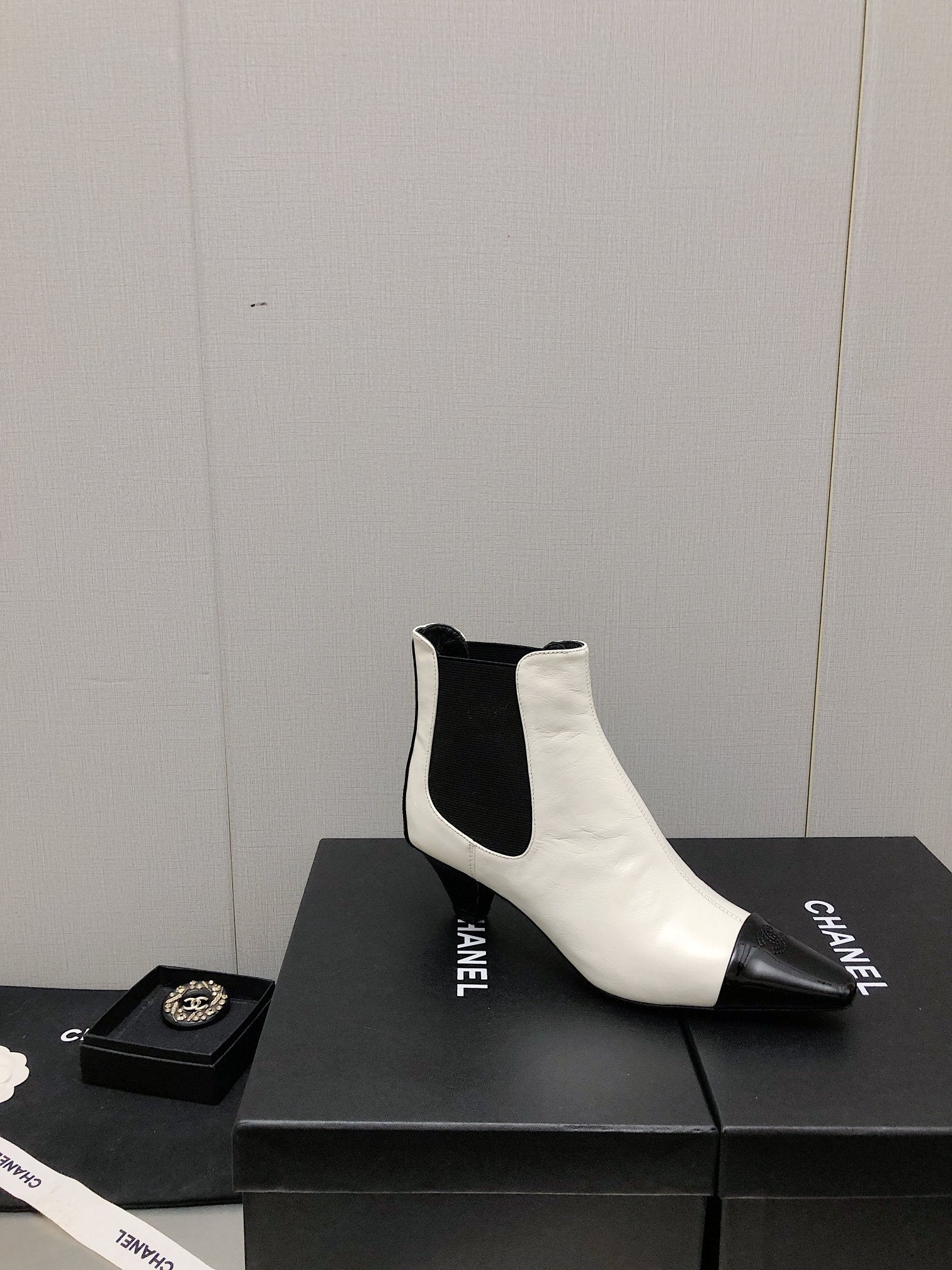 CHANEL SHORT BOOTS IN WHITE MIX BLACK SHEEPSKIN