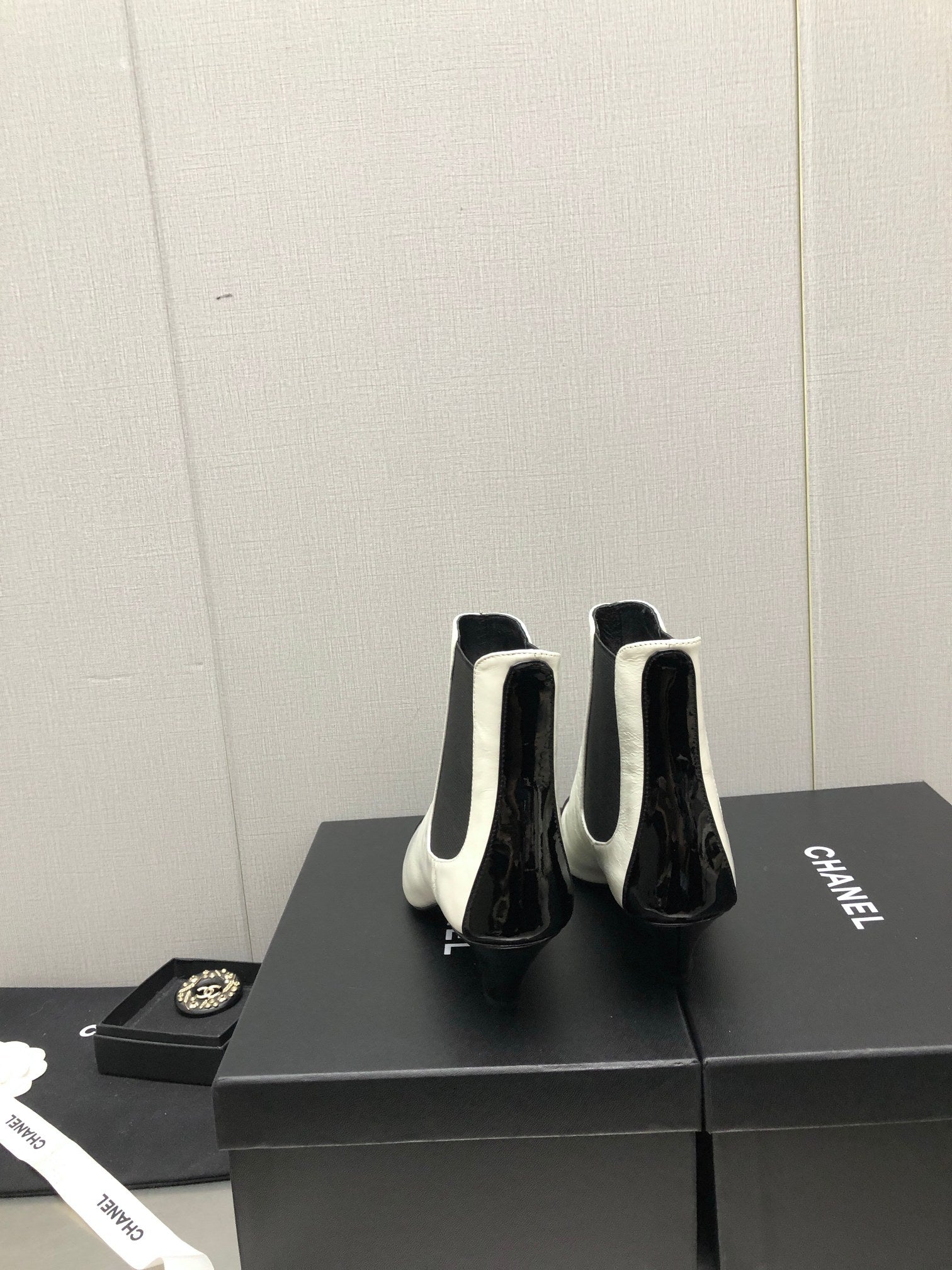 CHANEL SHORT BOOTS IN WHITE MIX BLACK SHEEPSKIN