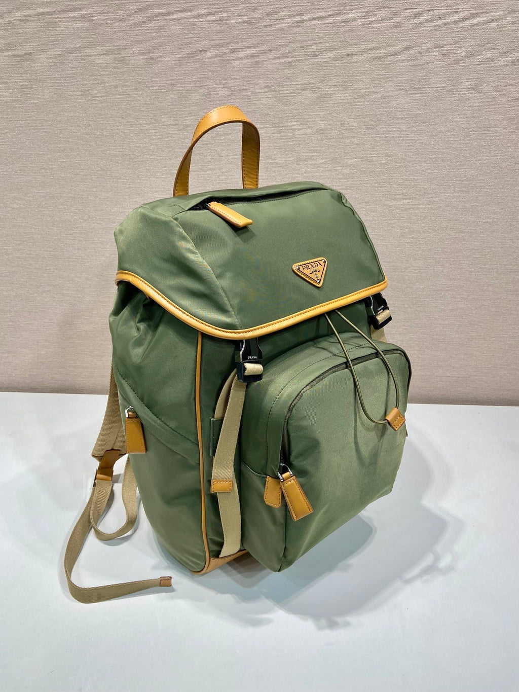 PRADA BACKPACK 45 IN SEAWEED GREEN RE-NYLON AND BROWN CALFSKIN TRIM