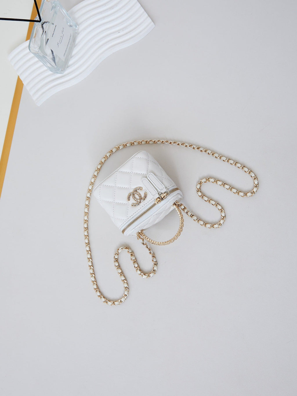 CHANEL 25S MINI VANITY BAG 11 CM IN WHITE LAMBSKIN WITH CRYSTAL-EMBELLISHED  LOGO