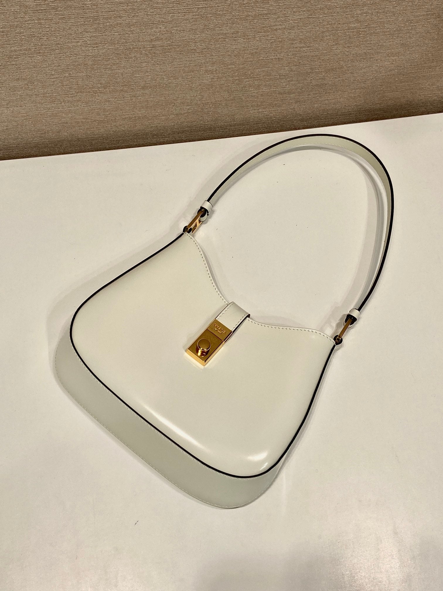 PRADA CLEO SHOULDER BAG 22 IN WHITE BRUSHED LAMBSKIN WITH CLASP CLOSURE