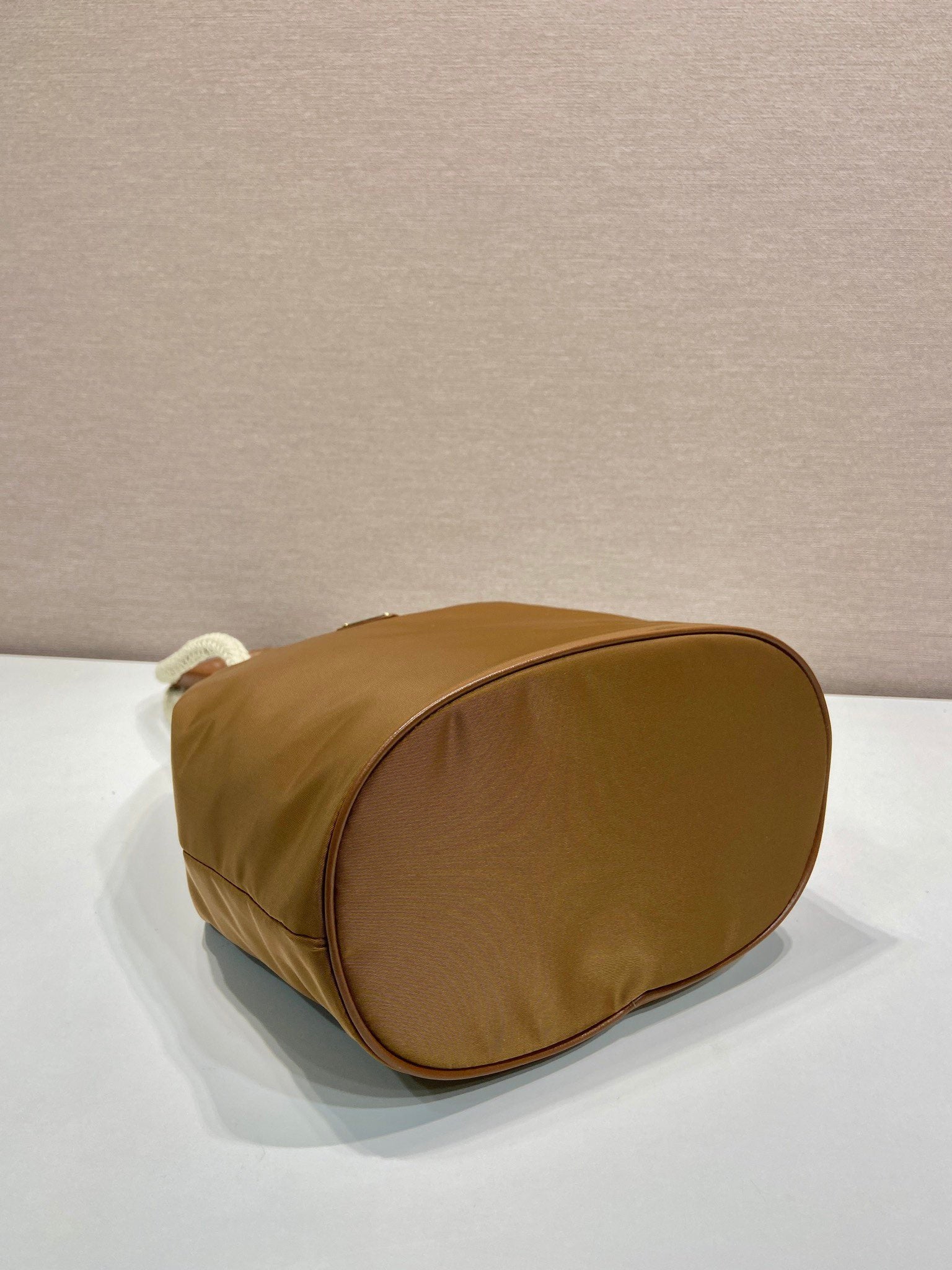 PRADA BUCKET BAG 28 IN SEPIA BROWN RE-NYLON GOLD LOGO