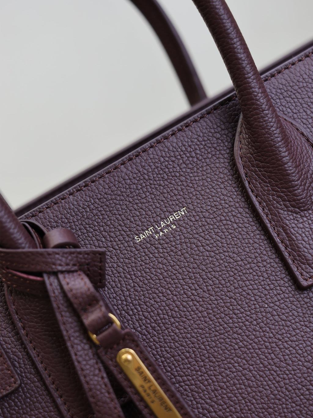 YSL 25S SAC DE JOUR GM 32 IN ROUGE CABERNET SUPPLE GRAINED CALFSKIN
