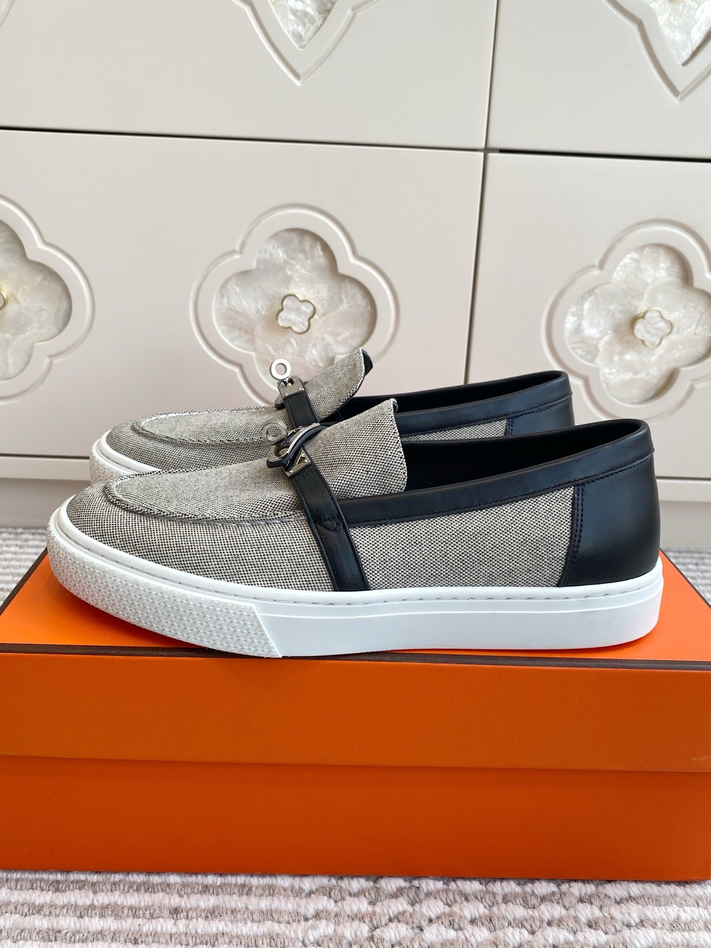 HERMES 25S SLIP-ON IN GREY CANVAS AND BLACK LAMBSKIN WITH SILVER HARDWARE