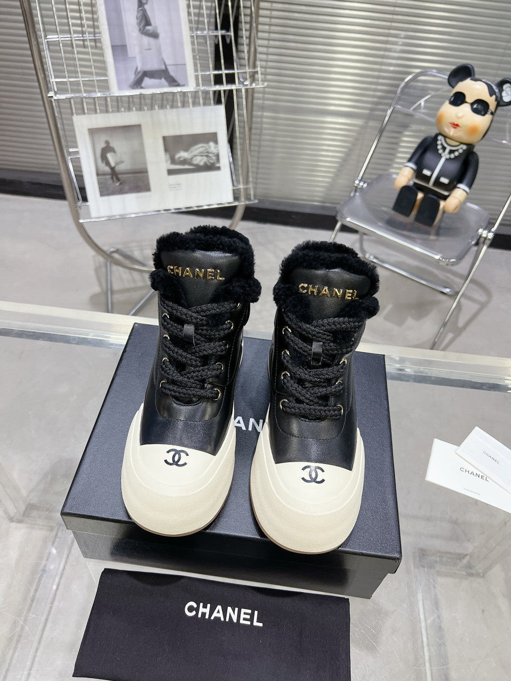 CHANEL MARTIN BOOTS IN BLACK CALFSKIN AND LAMB FUR LINING