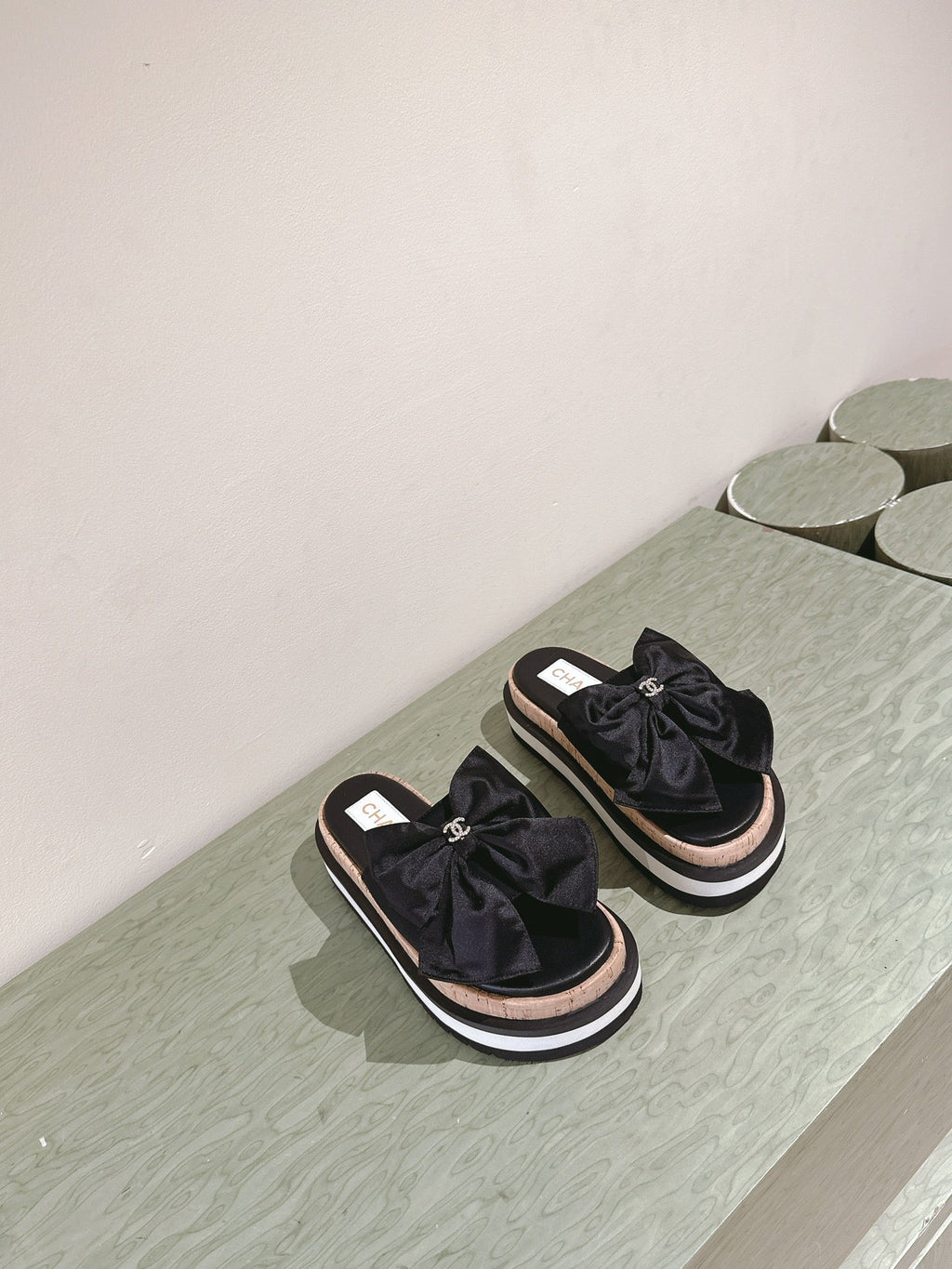 CHANEL SLIPPERS WITH SILK BOW IN BLACK COWHIDE