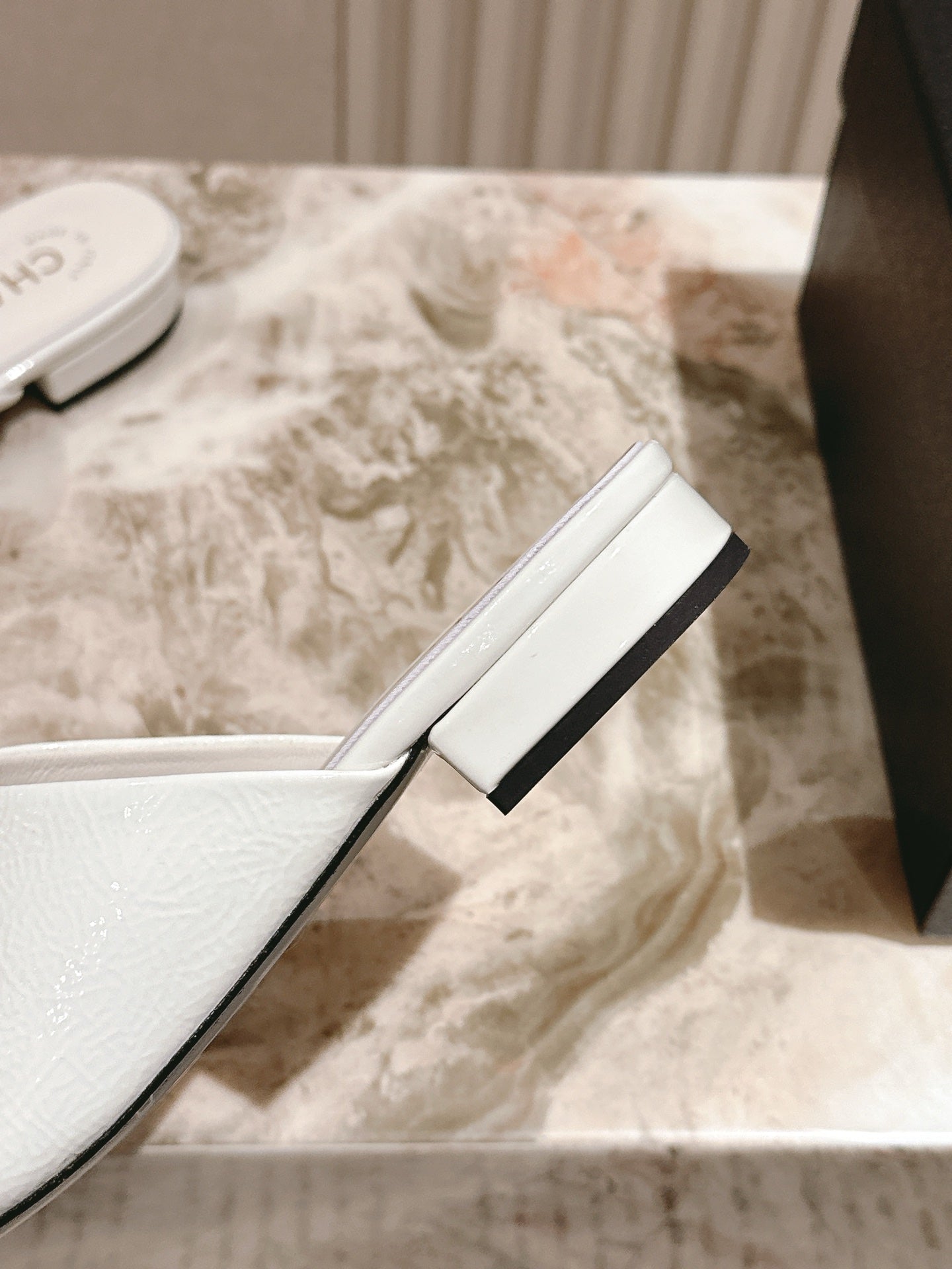 CHANEL FLAT MULES 25S IN WHITE PATENT LEATHER