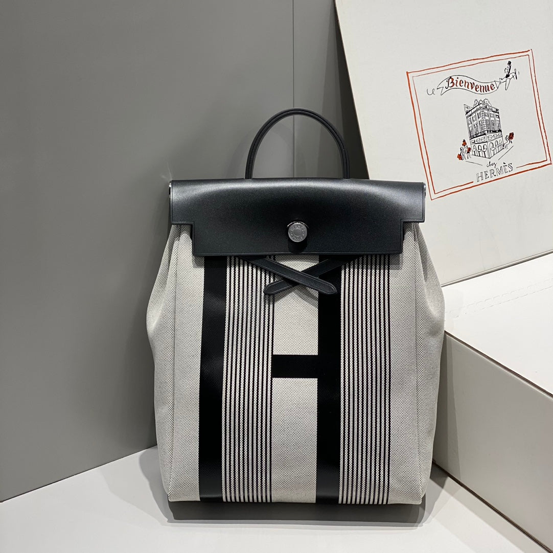 HERMES HERBAG A DOS ZIP RETOURNE BACKPACK 29 IN OFF-WHITE MIX BLACK CANVAS AND CALFSKIN