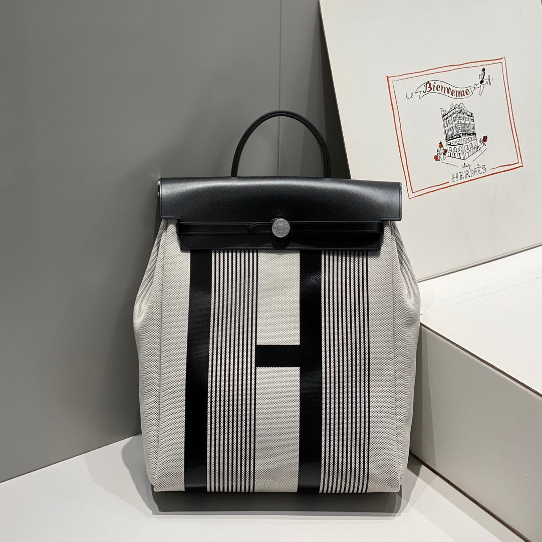 HERMES HERBAG A DOS ZIP RETOURNE BACKPACK 29 IN OFF-WHITE MIX BLACK CANVAS AND CALFSKIN