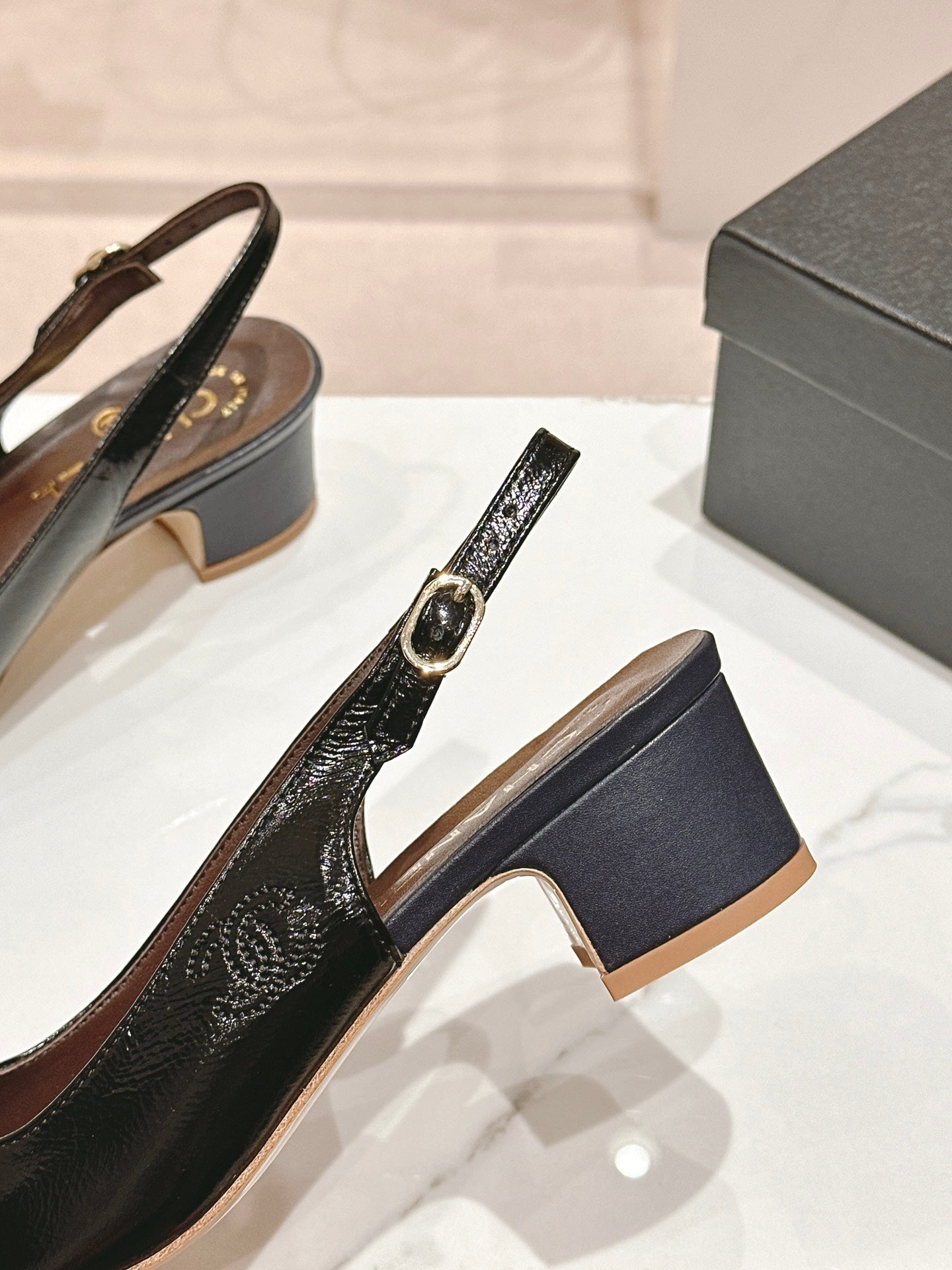 CHANEL SLINGBACKS IN BLACK SHEEPSKIN