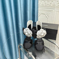 CHANEL HIGH HEELS IN BLACK SHEEPSKIN WITH WHITE FLOWER