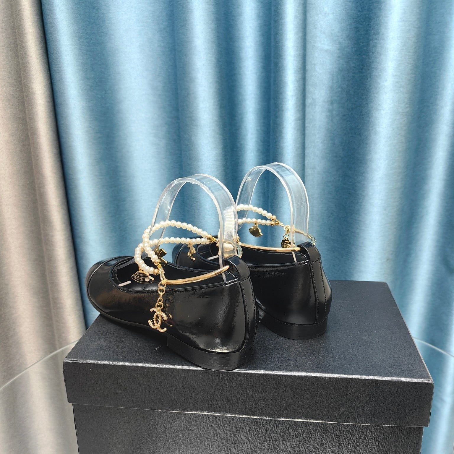 CHANEL MARY JANE WITH PEARL STRAP IN GLOSSY BLACK LAMBSKIN