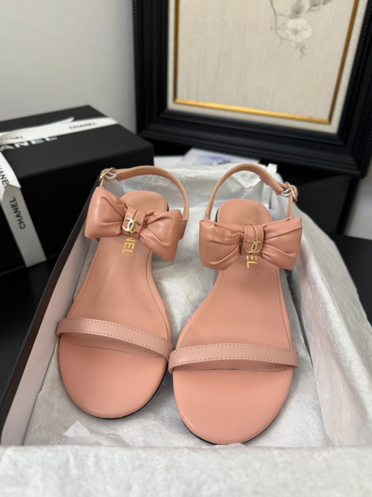 CHANEL FLAT SANDALS IN PEACHY PINK CALFSKIN WITH BOW