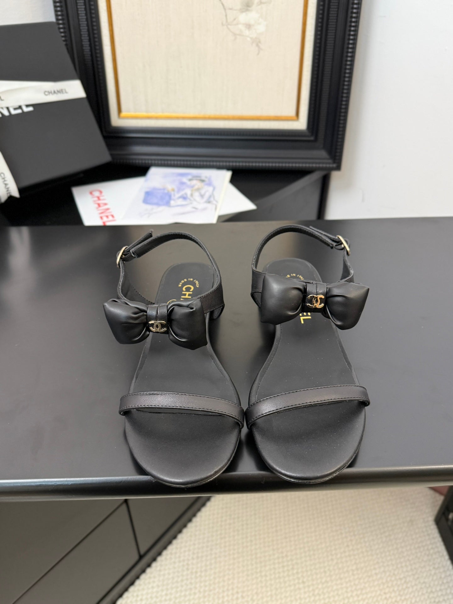 CHANEL FLAT SANDALS IN BLACK CALFSKIN WITH BOW