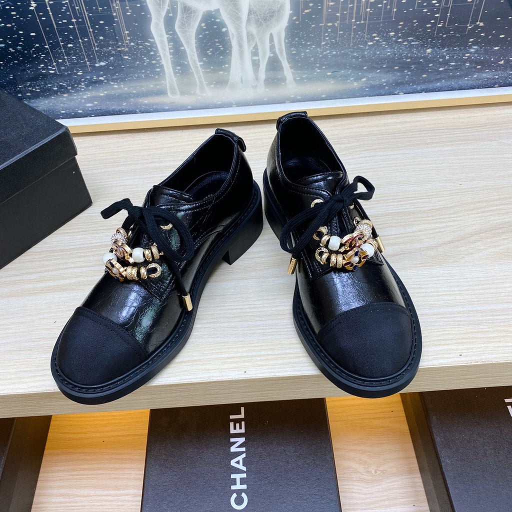 CHANEL COMBAT OXFORD SHOES IN BLACK WRINKLED CALFSKIN AND GROSGRAIN WITH FAUX PEARL