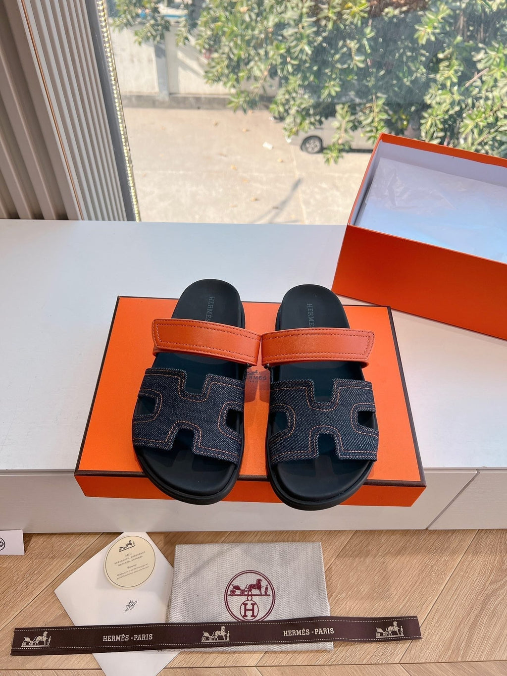 HERMES CHYPRE SANDAL IN BLACK DENIM AND VIVID ORANGE CALFSKIN