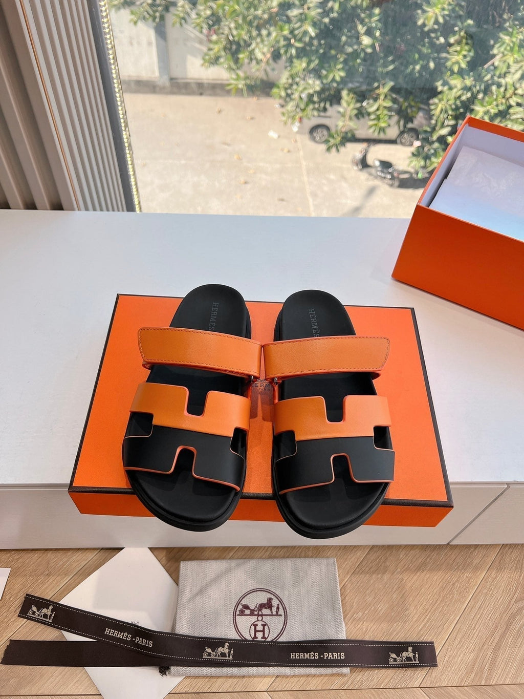 HERMES CHYPRE SANDAL IN VIVID ORANGE MIX BLACK CALFSKIN
