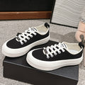 CHANEL LACE-UP SNEAKERS IN BLACK CANVAS