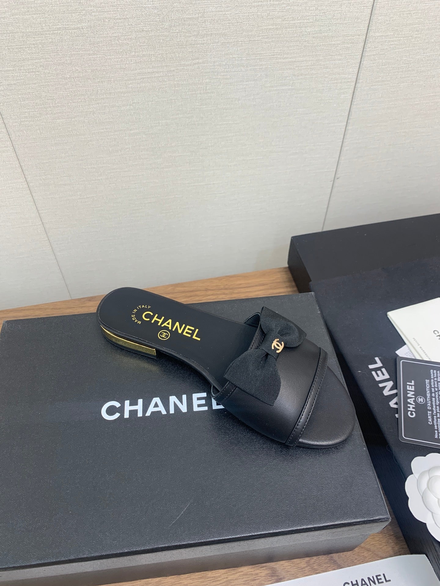 CHANEL BOW SLIPPERS IN BLACK LAMBSKIN
