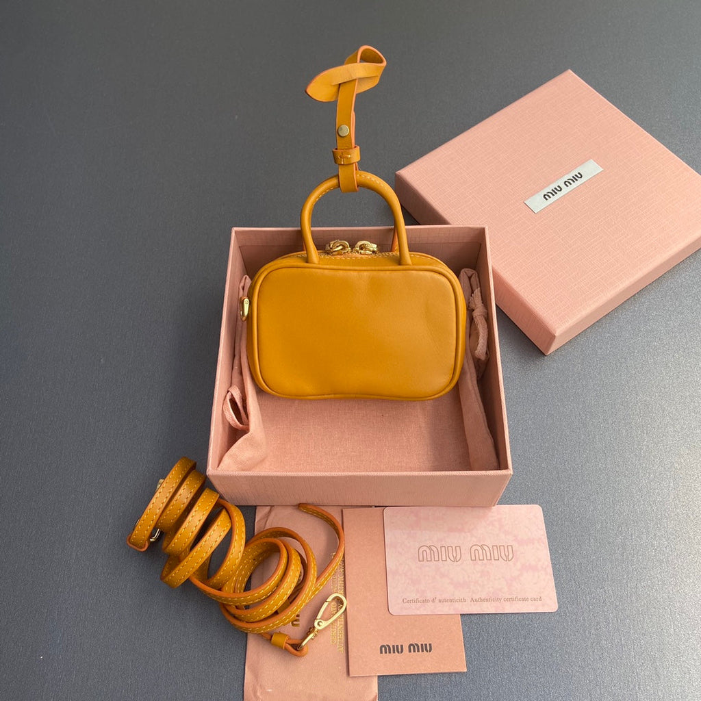 MICRO BAG KEYCHAIN 11 IN INDOCHINE ORANGE CALFSKIN EMBOSSED LOGO