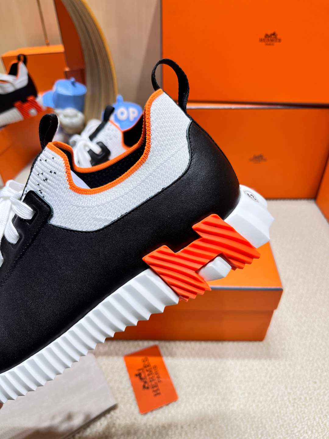 HERMES DEPART SLIP-ON SNEAKER IN WHITE MIX BLACK KNIT AND BLACK CALFSKIN