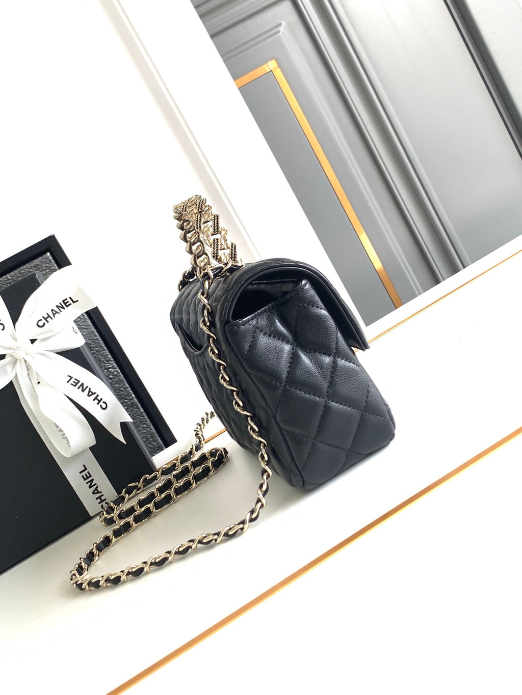 CHANEL MINI 20 FLAP BAG IN BLACK CALFSKIN