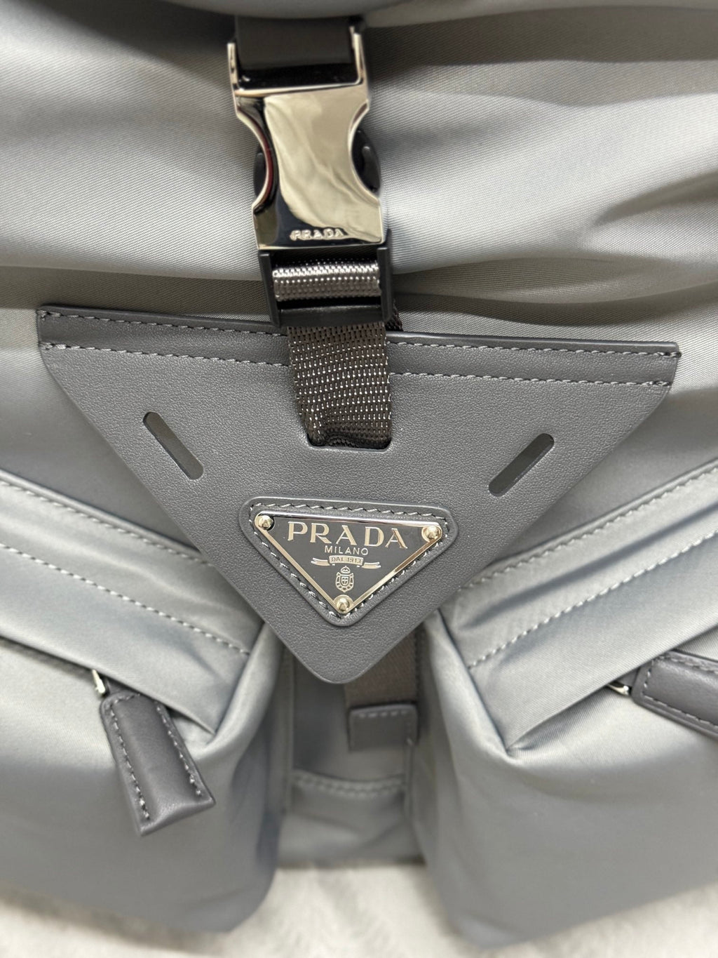 PRADA TRIANGLE LOGO BACKPACK 42 IN RHINO GRAY RE-NYLON