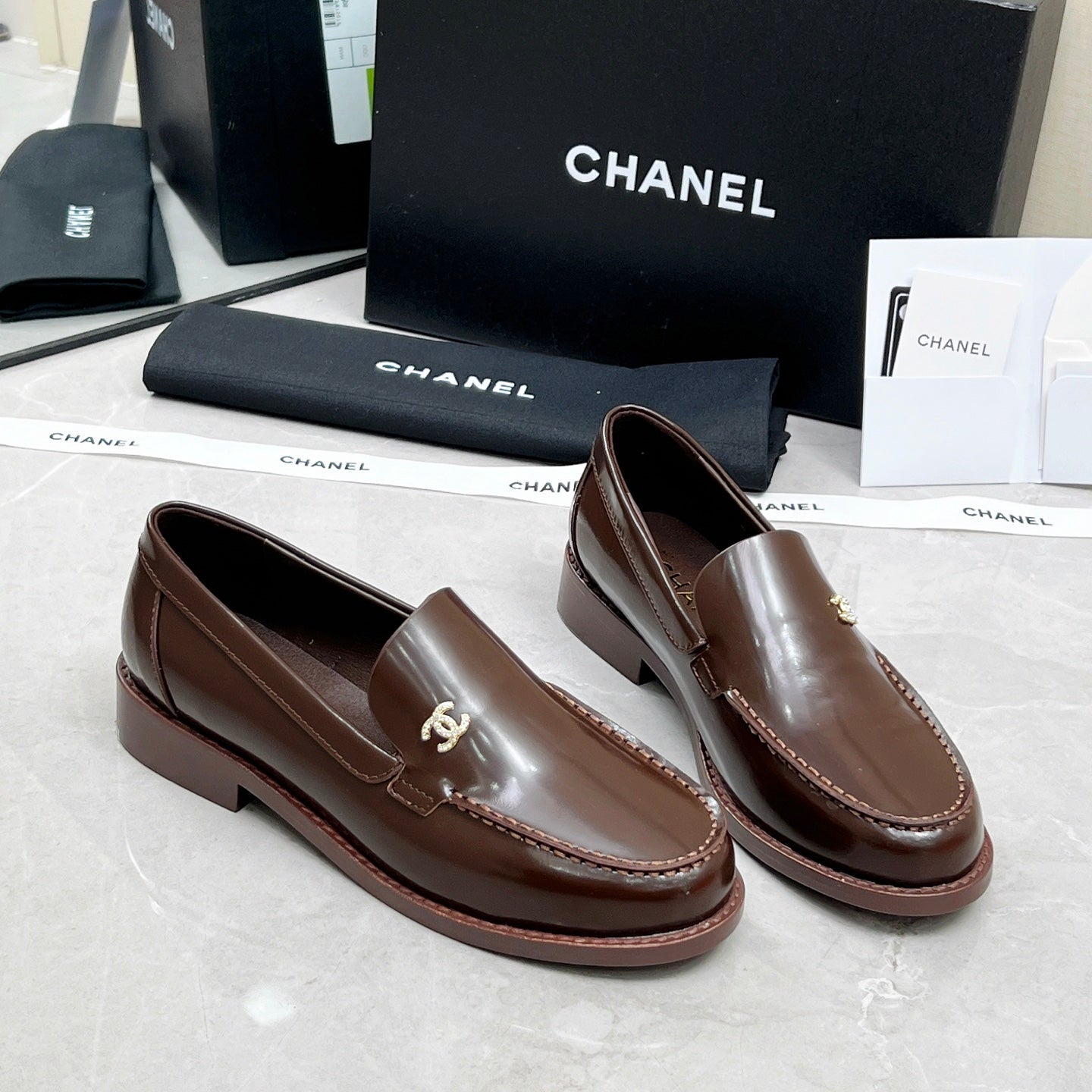 CHANEL MOASINS IN BROWN CALFSKIN