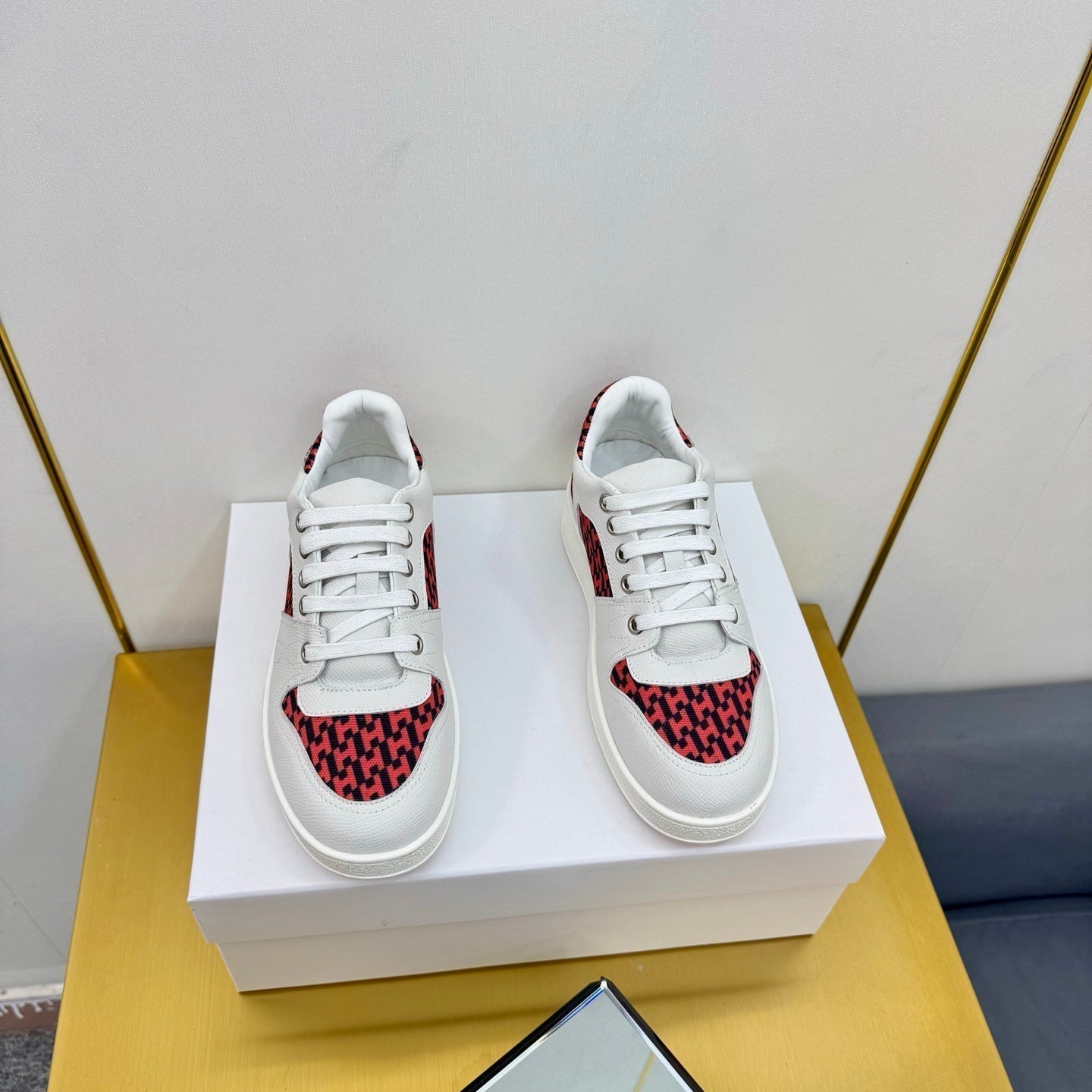 HERMES FREE SNEAKER IN WHITE CALFSKIN AND "H EN BIAIS" RED CANVAS.