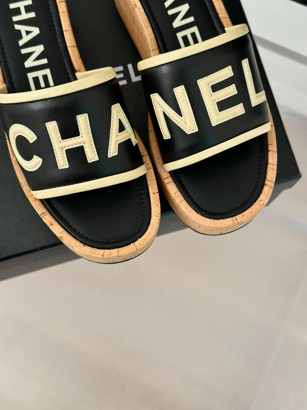CHANEL THICK SOLE LETTER SLIPPERS IN BLACK SHEEPSKIN