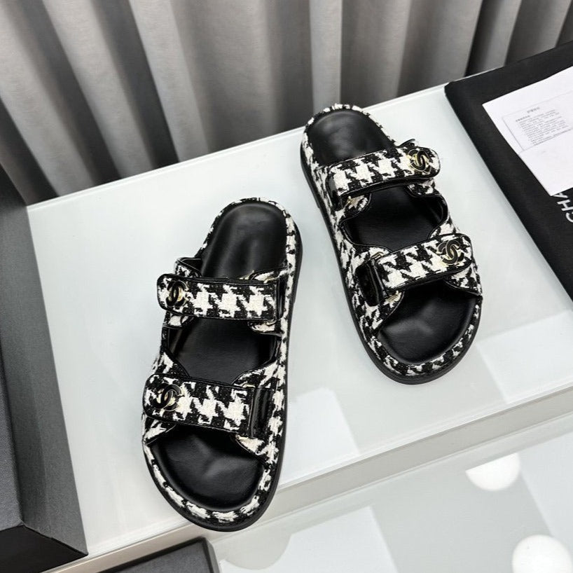 CHANEL dad sandals black white mules