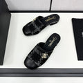 CHANEL FLAT MULE IN BLACK WOOL TWEED AND CALFSKIN GOLD HARDWARE