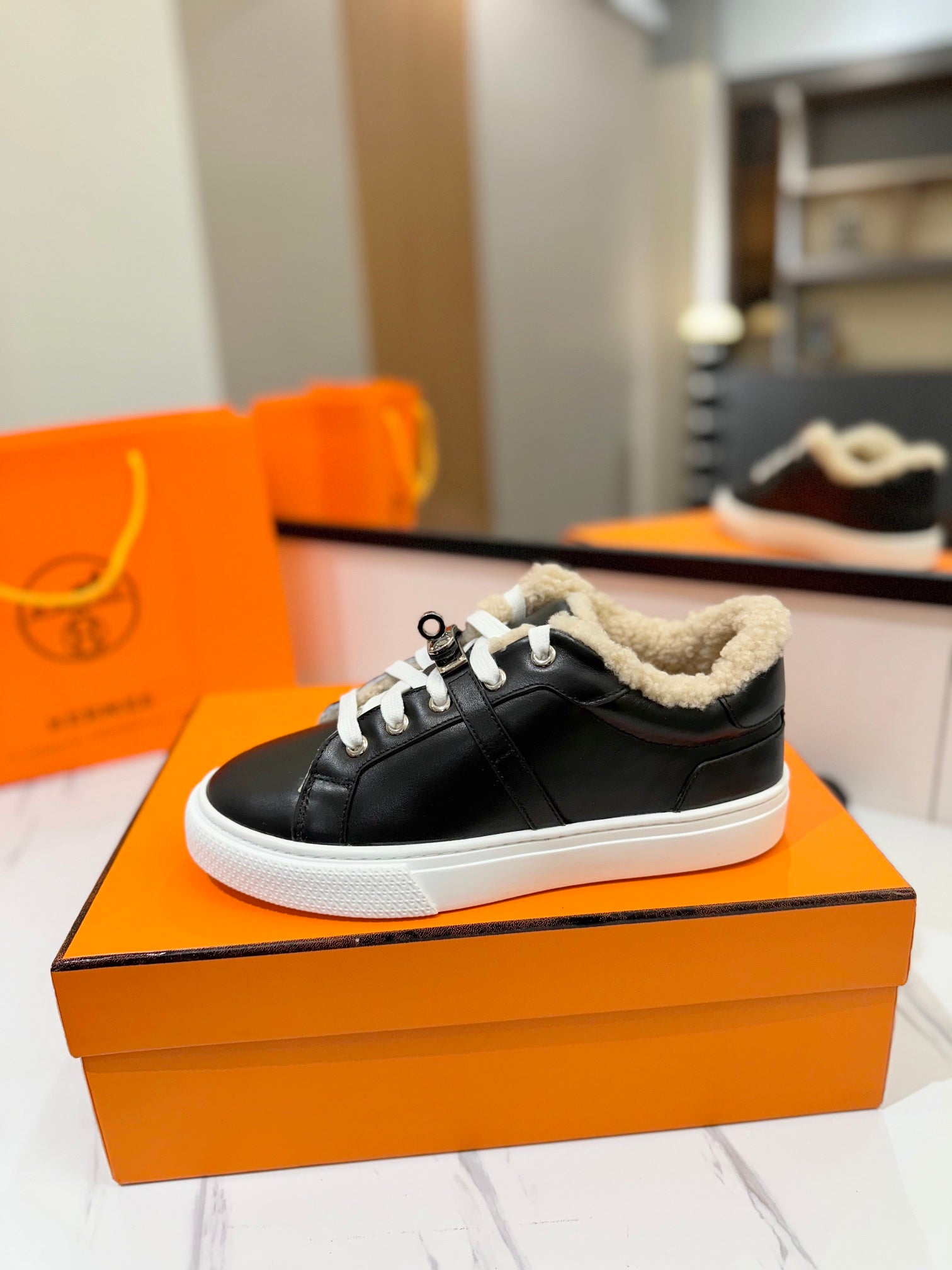 HERMES DAY SNEAKER IN BLACK CALFSKIN AND FLEECE LINING